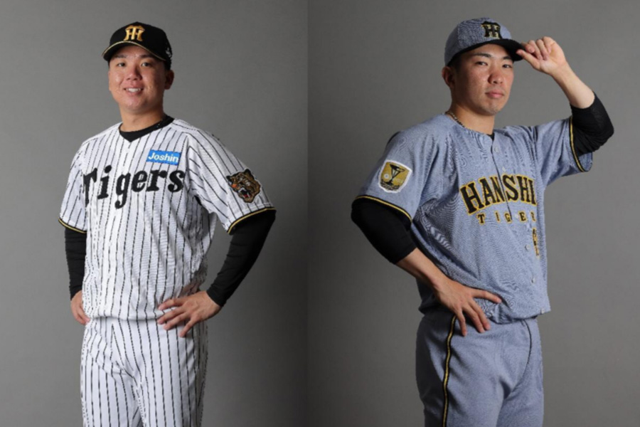 来季のユニホームを着用する阪神・村上頌樹(左)と石井大智【写真:球団提供】